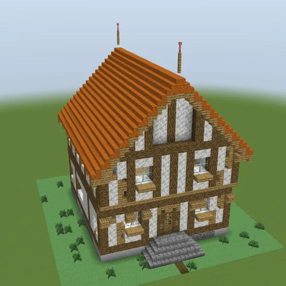Minecraft build of the timber-framed house with an orange tile roof and white panels between dark beams